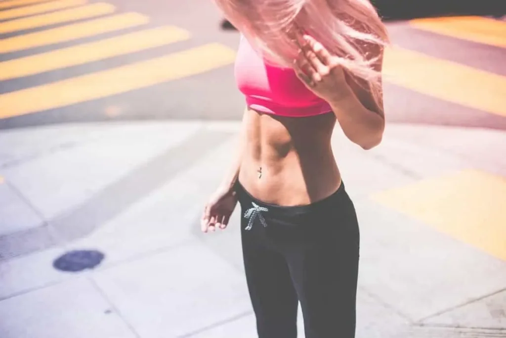Woman with toned stomach after LA-EMS Body Sculpting Treatment Bedfordshire